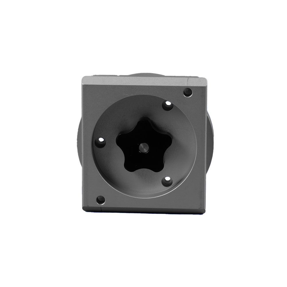 A metal object with screws and a knob on it