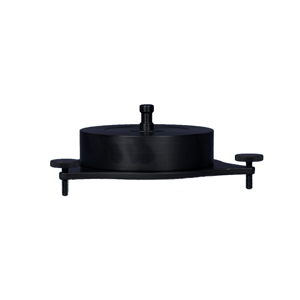 A black object with a handle on top of it on a white background.