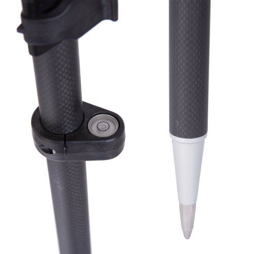 A black pole with a white tip on a white background.