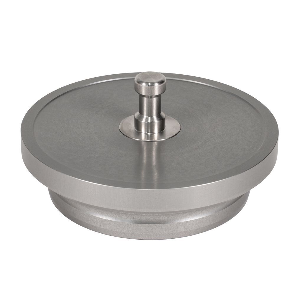 A metal object with a hole in the middle on a white background