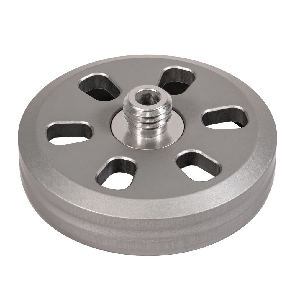 A metal wheel with holes in it and a bearing in the middle