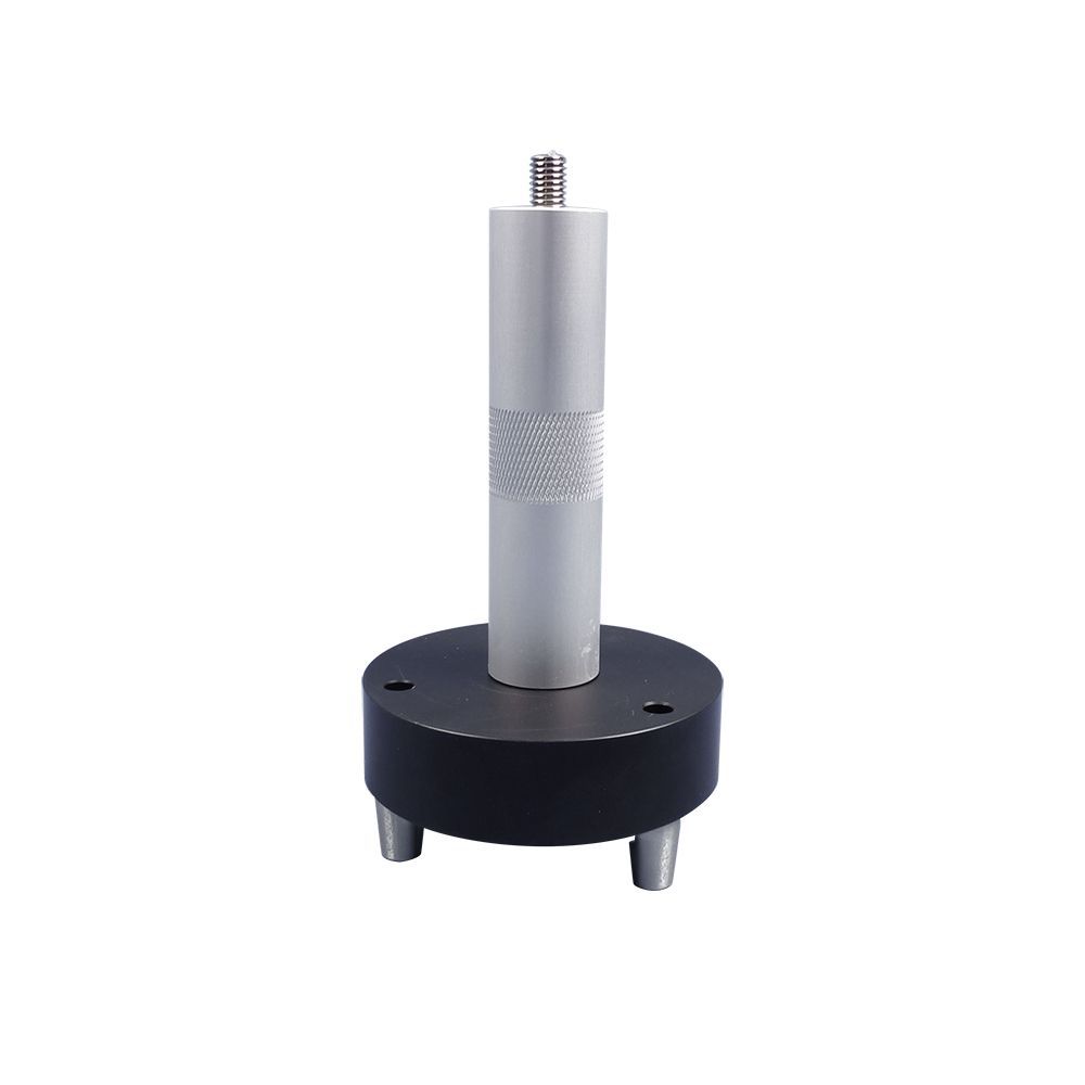 A white ball is sitting on top of a metal pole.