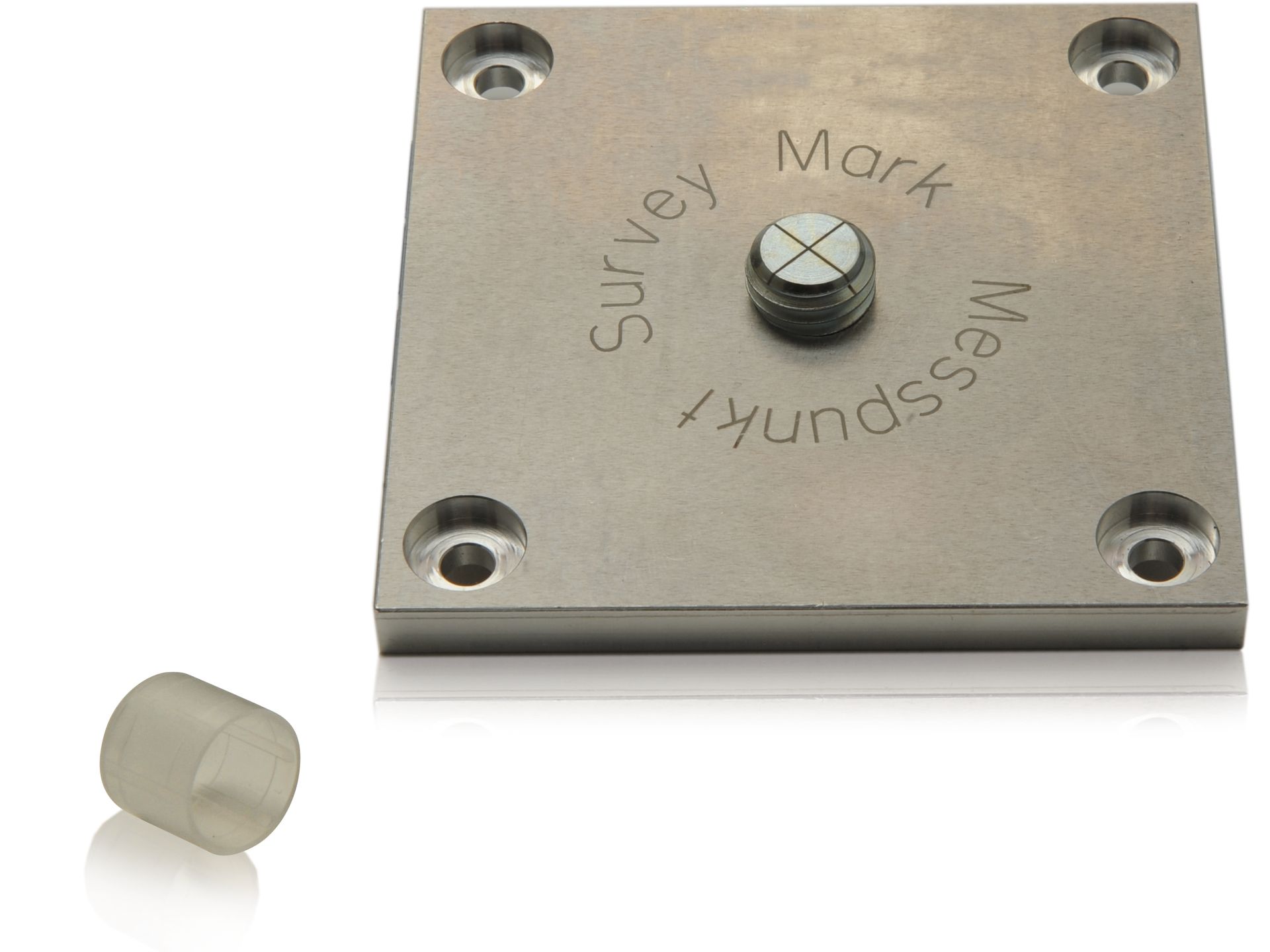 A square piece of metal that says survey mark messpunkt
