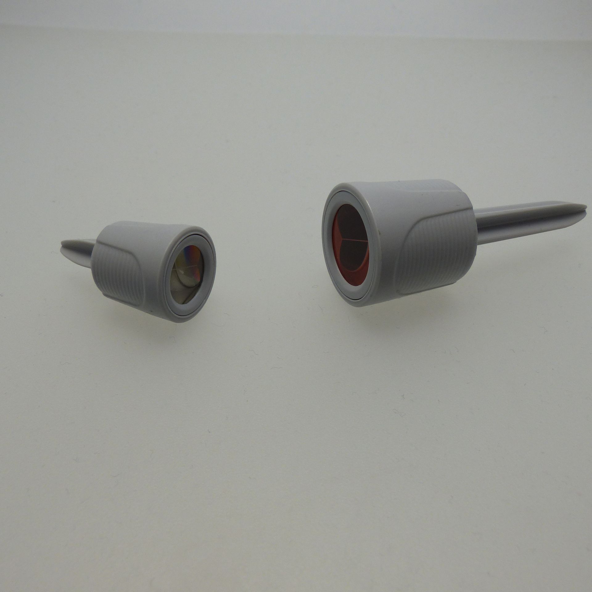 A gray object with a red circle in the middle