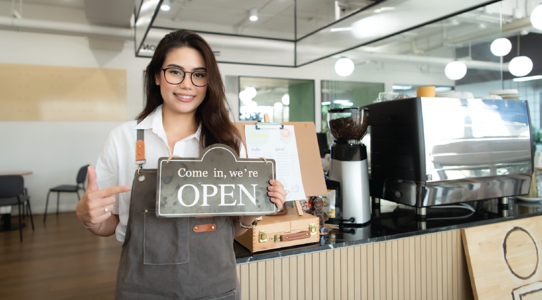 Woman in apron holding
