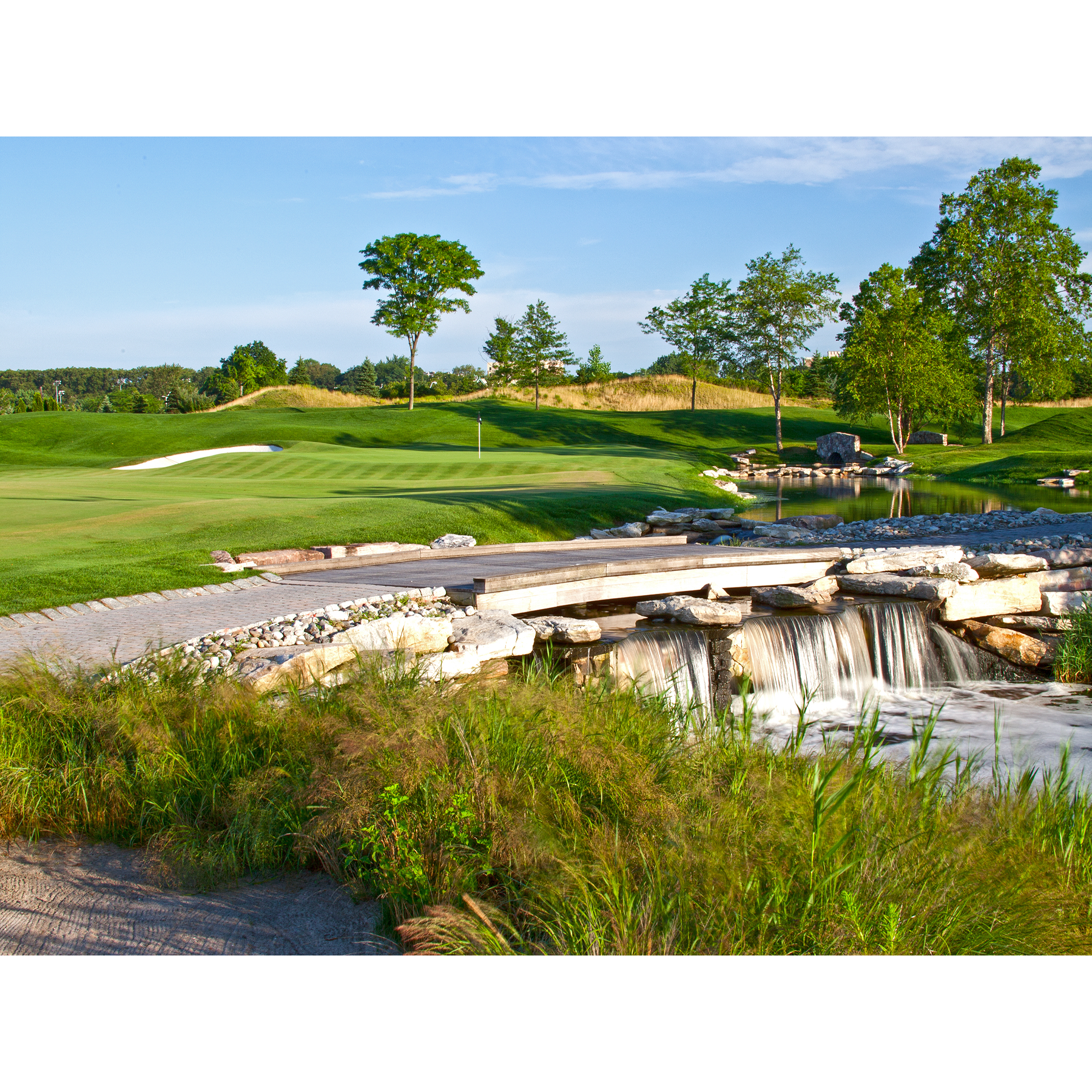A waterfall in the middle of a golf course