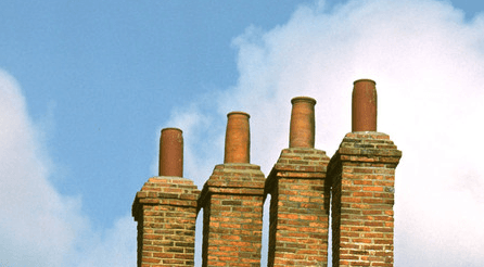 chimneys on top of the brick walling