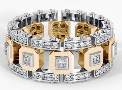 Diamond and gold ring with a geometric design.