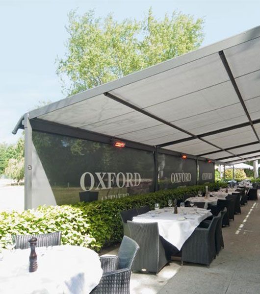 A restaurant called oxford has tables and chairs outside