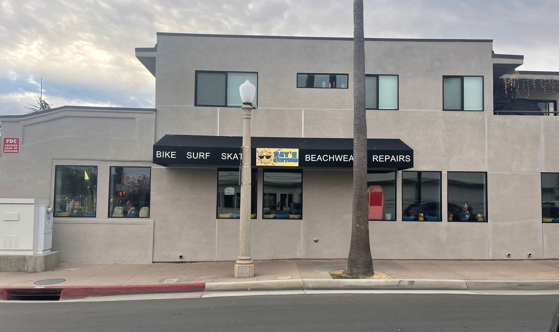 A building with a black awning and a sign that says ' a ' on it