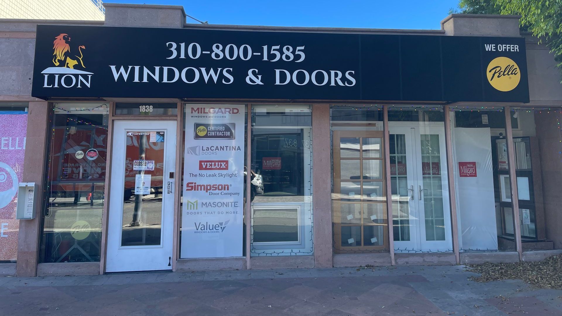 A building with a sign that says lion windows and doors