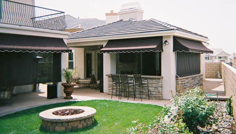 A house with a fire pit in front of it