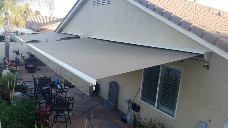 A house with a large awning on the side of it.