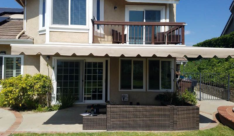 A large house with a large awning on the roof