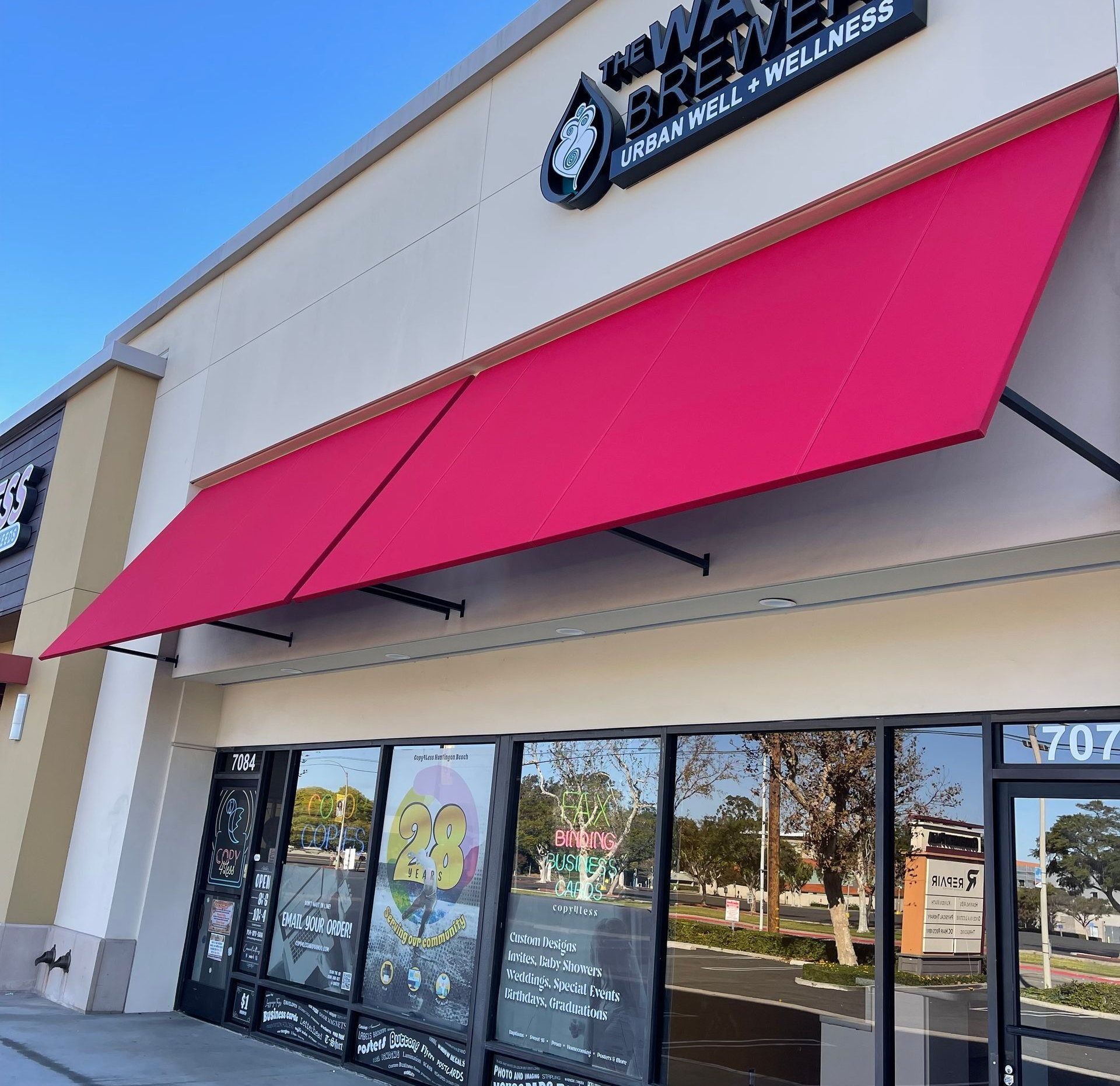 A store with a pink awning, 