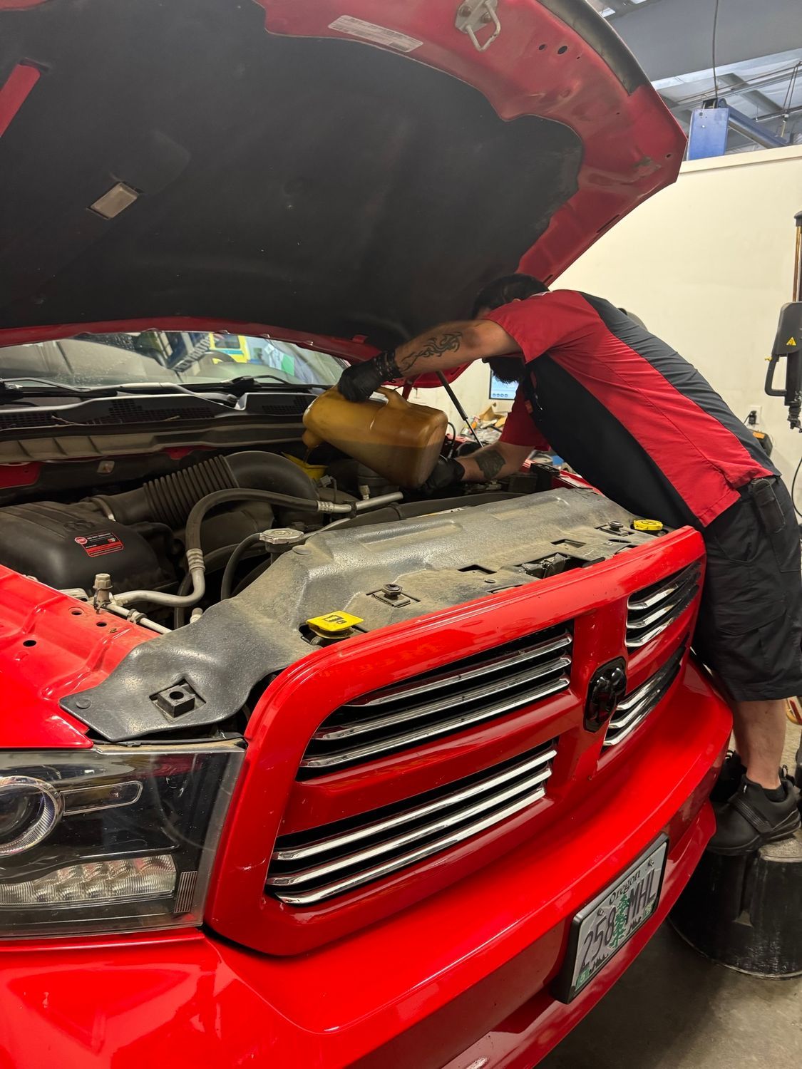 Mechanic Changing Oil in Albany, OR - Lava Auto Tire Service & Car Wash