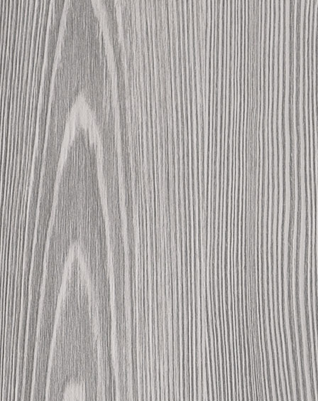 Un primo piano di un pezzo di legno che mostra la venatura del legno.