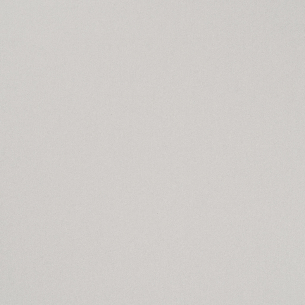 Un primo piano della trama di una carta bianca.