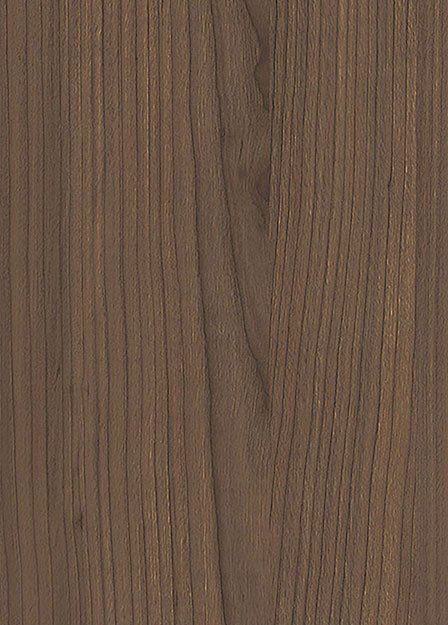 Un primo piano di un pezzo di legno che ne mostra la venatura e la consistenza.