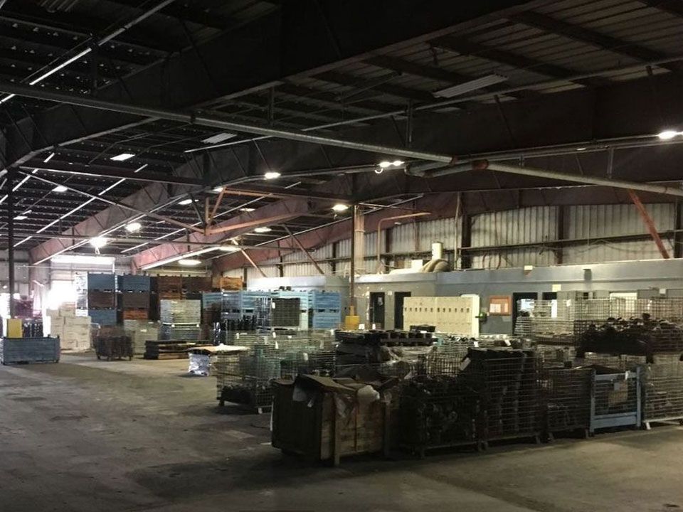 A large warehouse with a lot of machinery in it