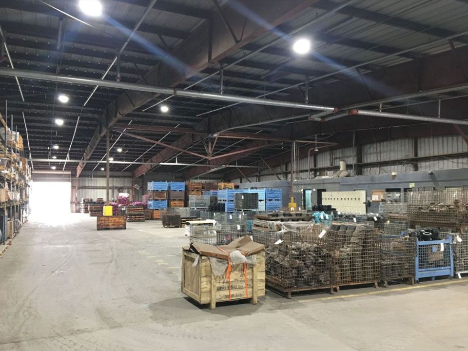 A large warehouse filled with lots of crates and boxes.