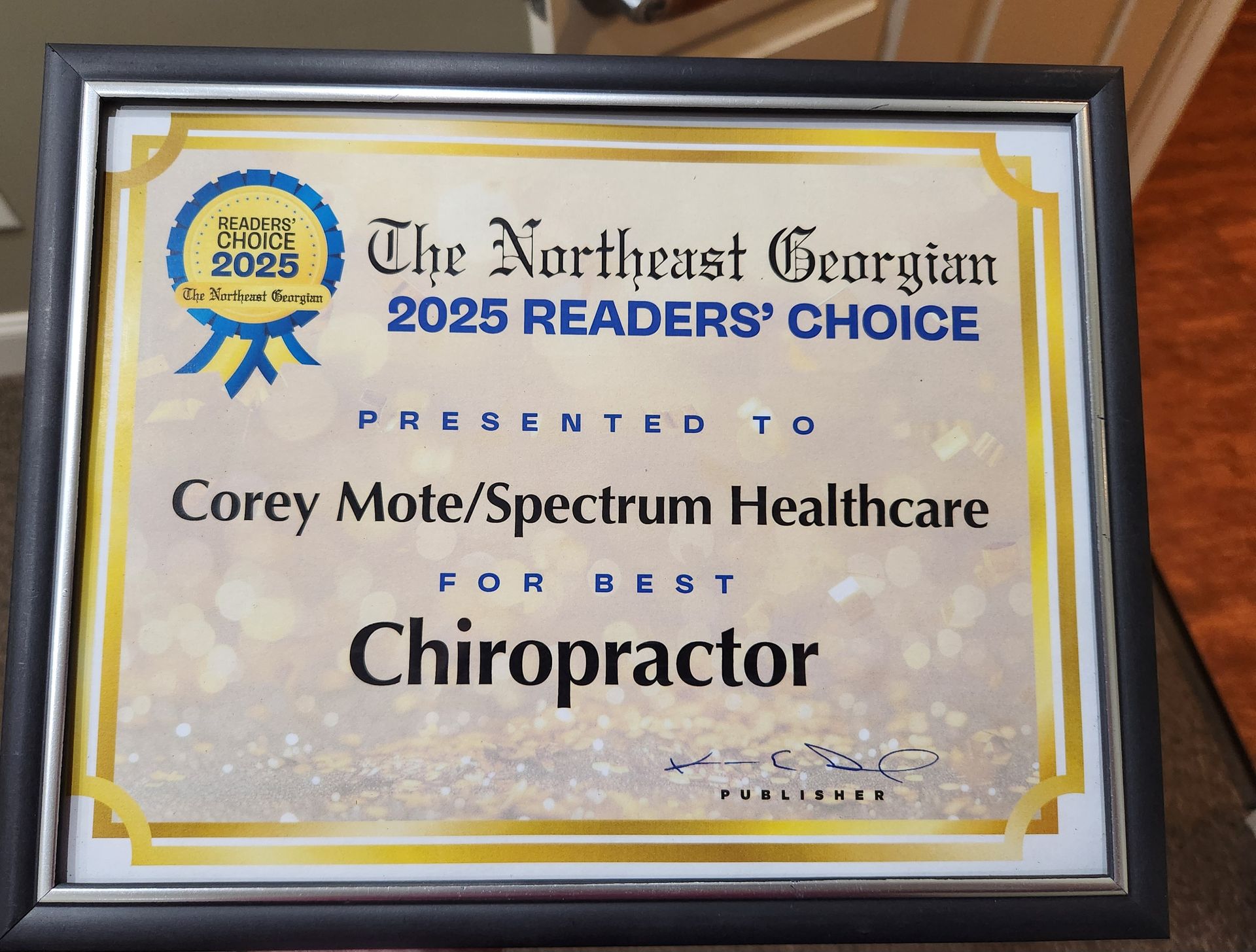 The northeast georgian 2025 readers ' choice presented to corey mole / spectrum healthcare for best chiropractor