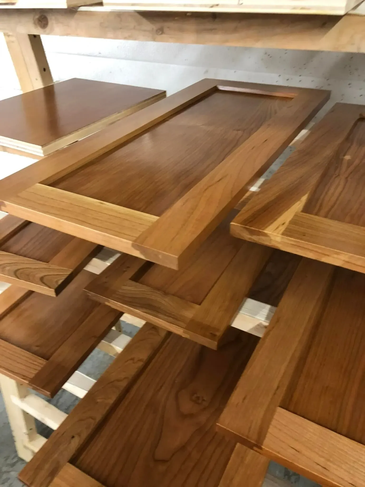 A wooden shelf with white shelves in a warehouse.