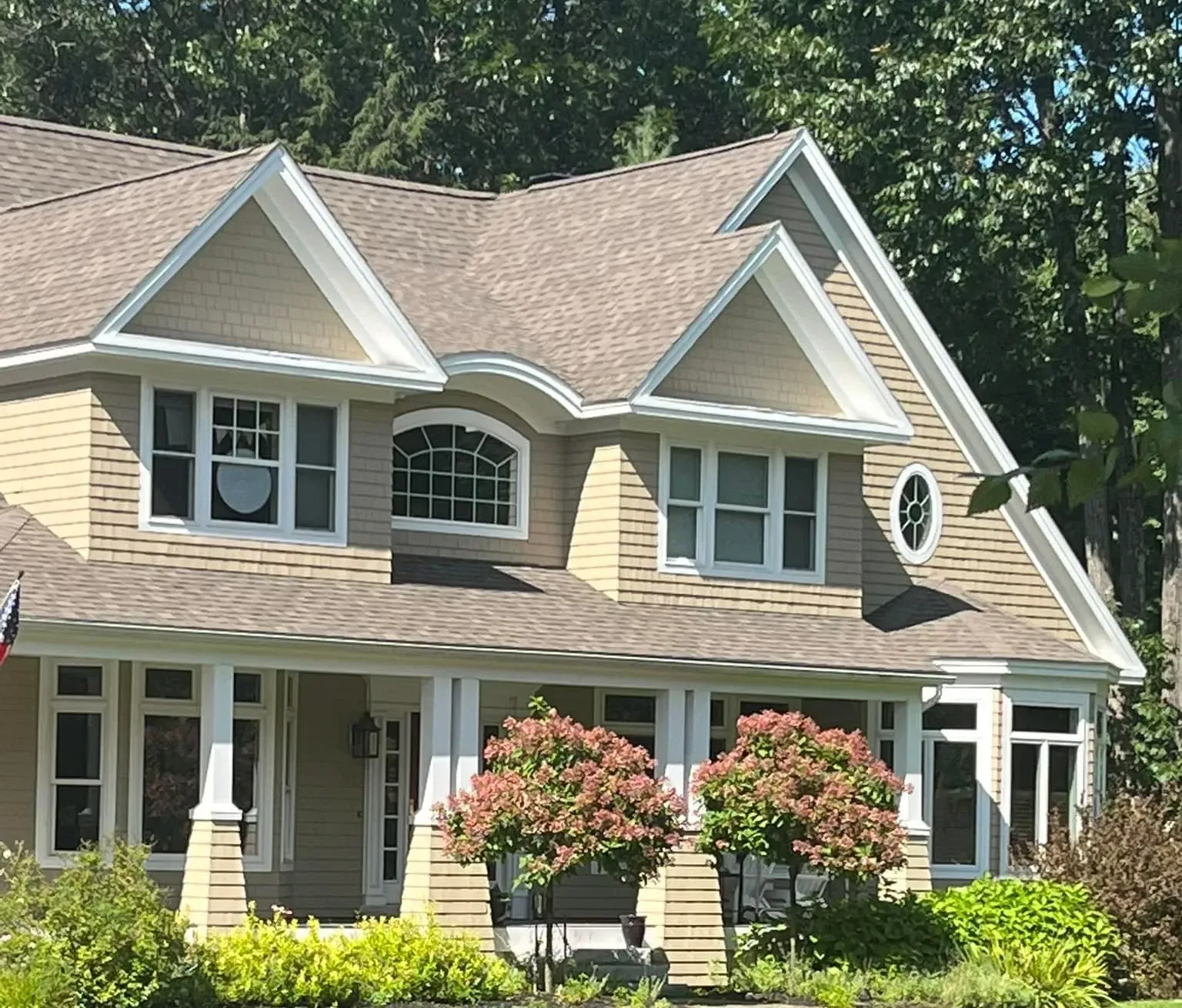 A house with a large porch and a large window