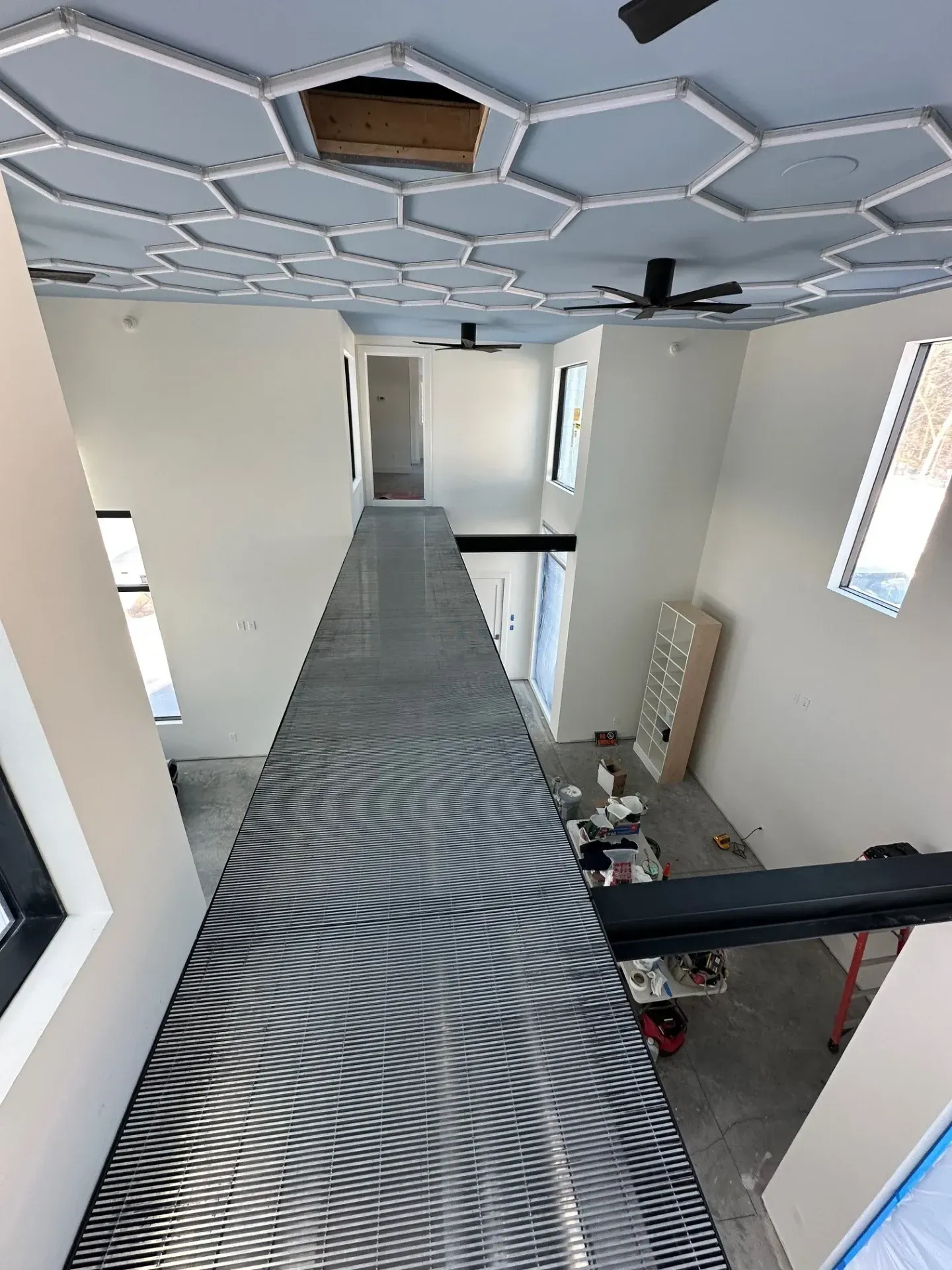 An aerial view of a hallway in a house under construction.