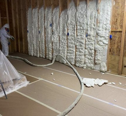 contractor installing spray foam insulation near Vancouver