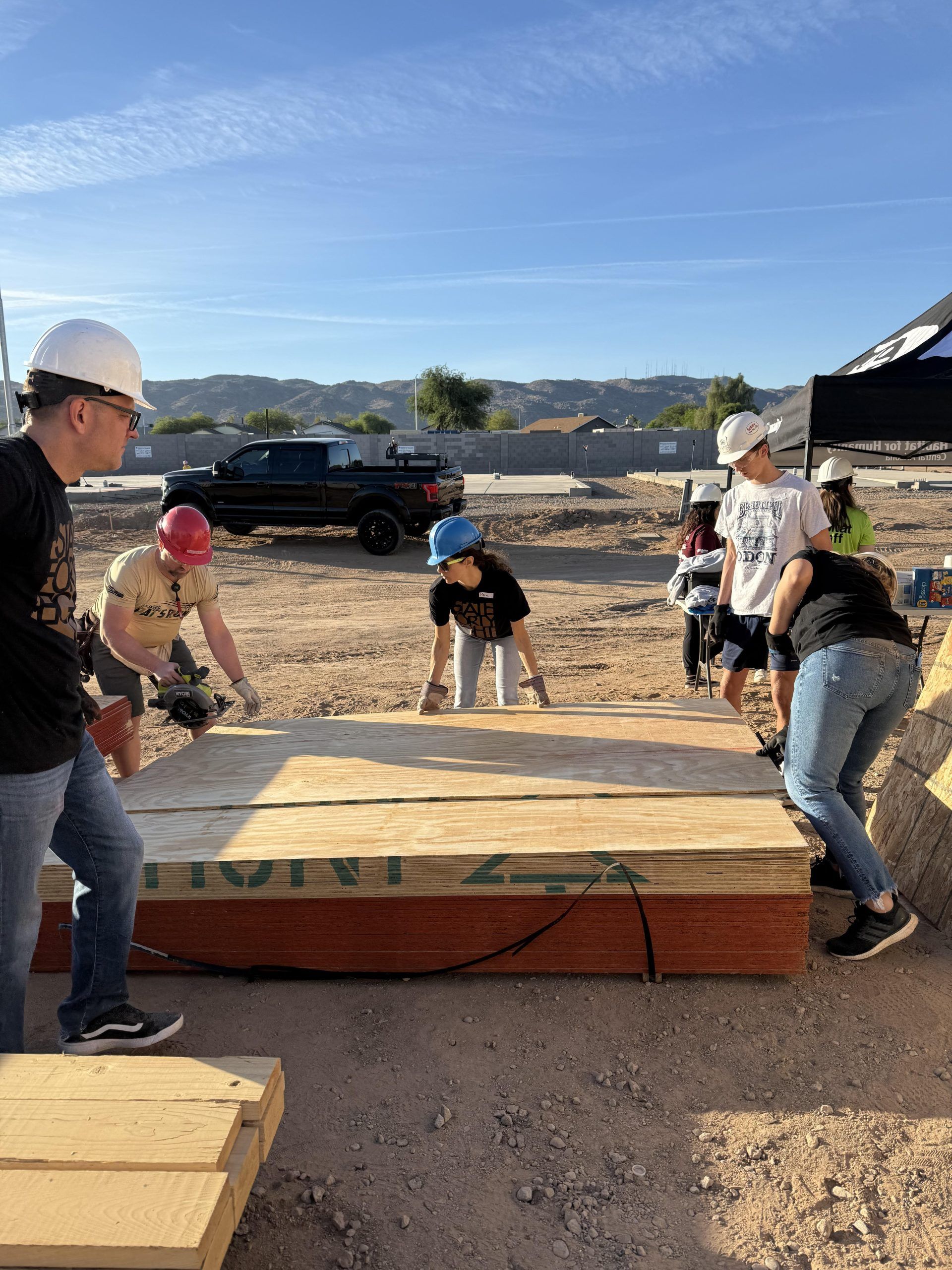 A group of people are working on a construction site.