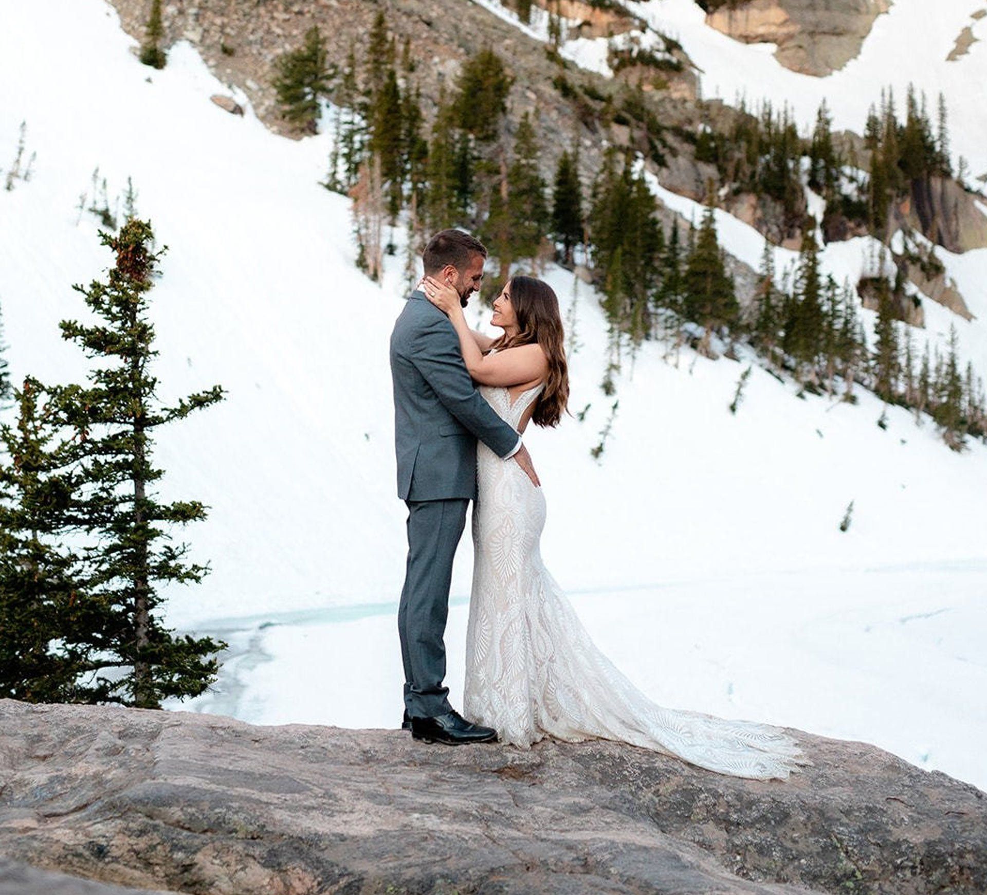 bride and groom staring at each other in snowy colorado mountain
