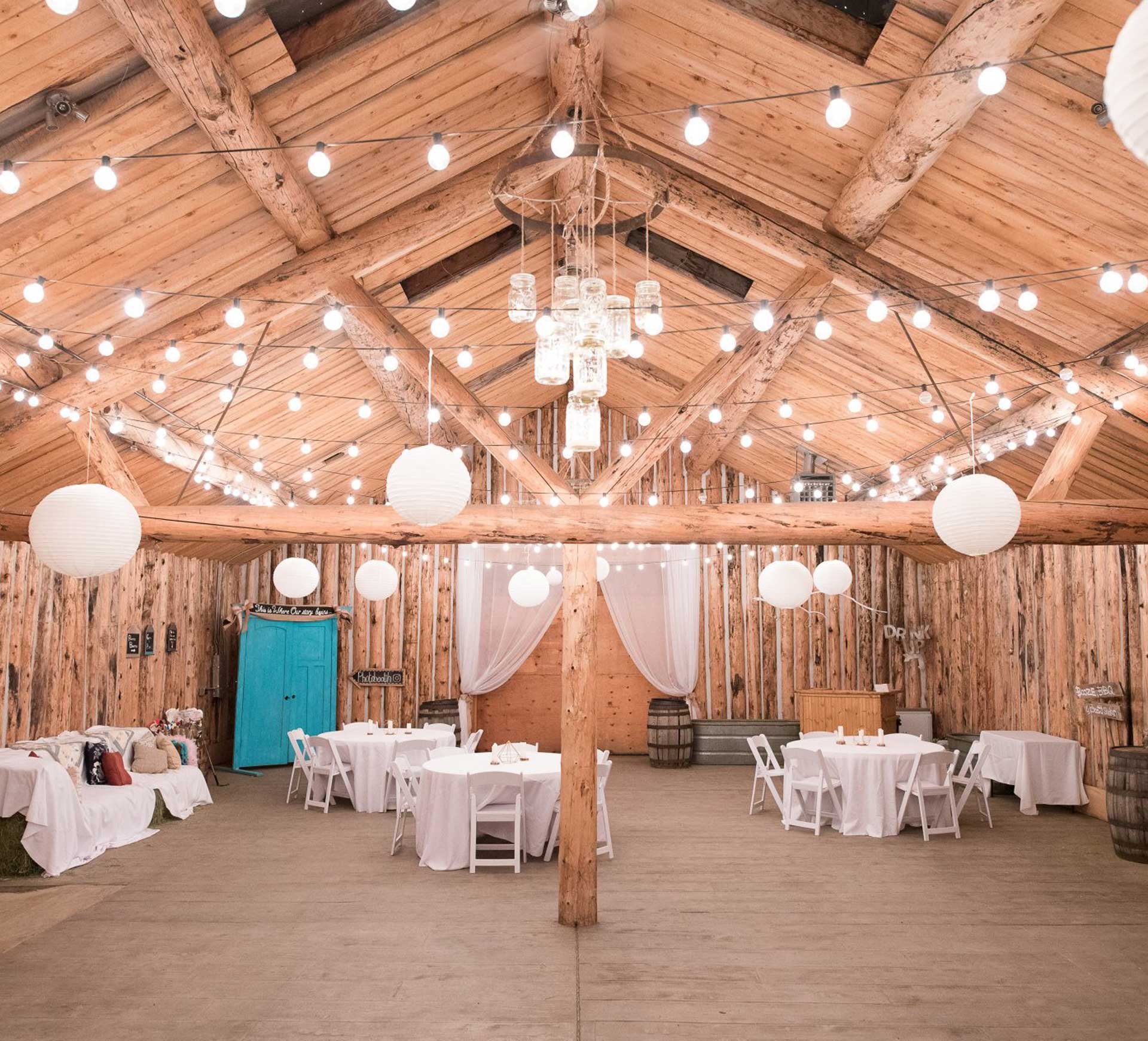 barn wedding reception with good lighting and paper lanterns