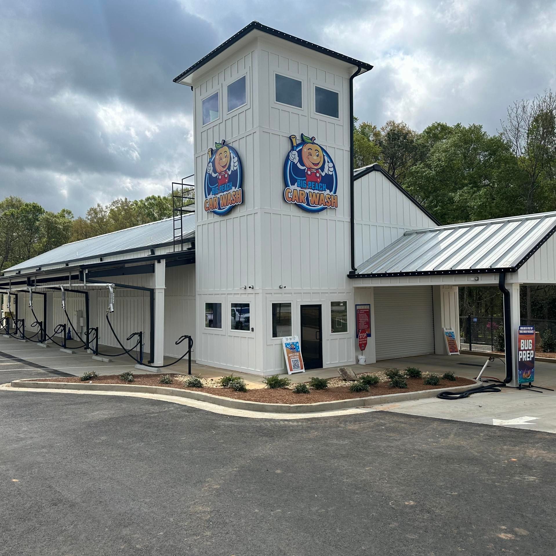 A white building with a tower on top of it