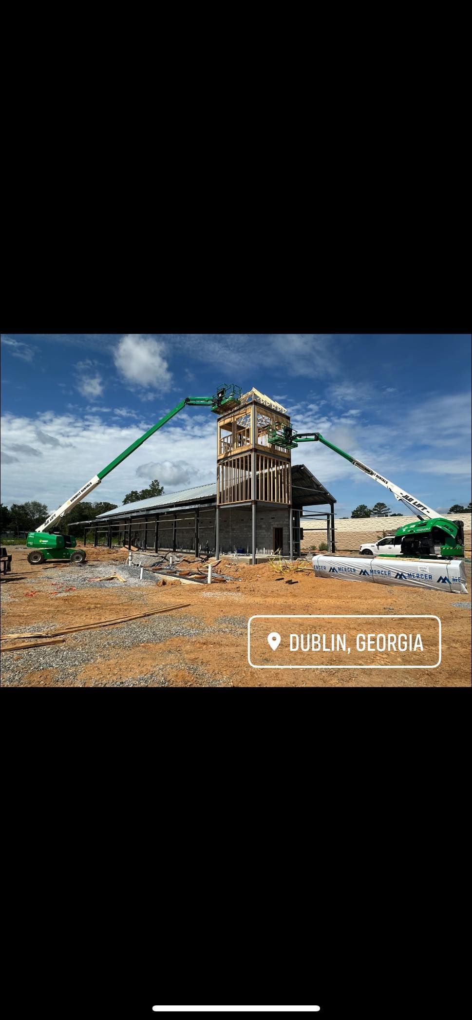 A large building is being built with a crane.