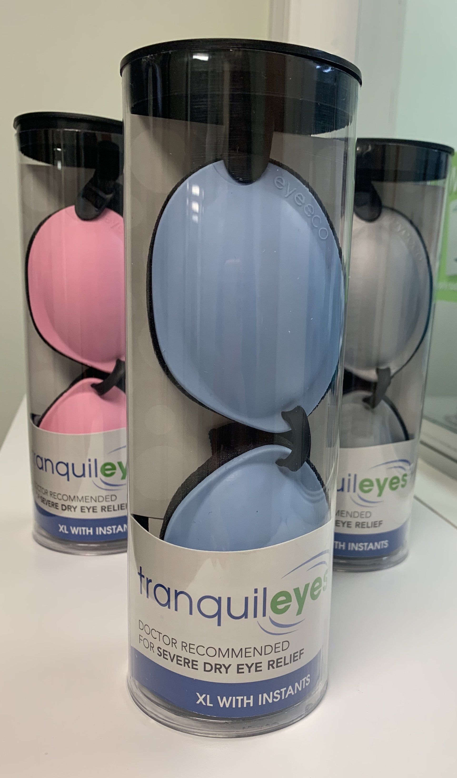 Three cylindrical packages of