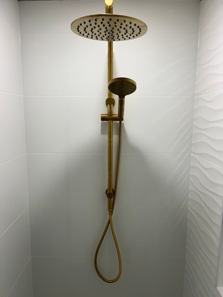 A Shower Head is Hanging From the Ceiling in a Bathroom — R.K. Plumbing & Gas In Bli Bli, QLD