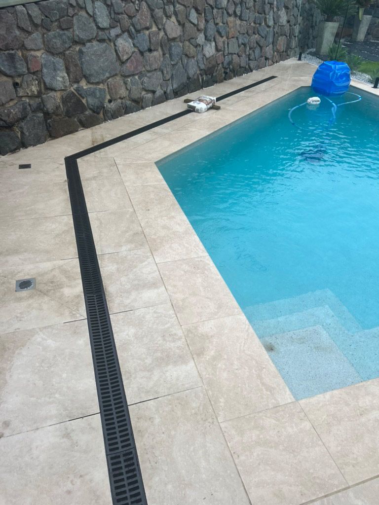 Large Swimming Pool With A Stone Wall — R.K. Plumbing & Gas In Bli Bli, QLD