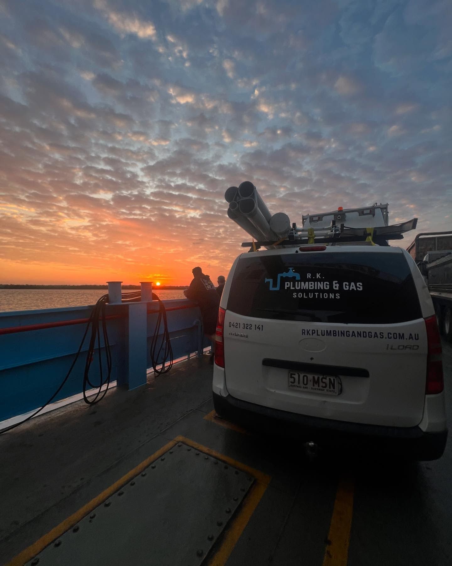 A Man Standing Next to a Plumbing and Gas Solutions Truck — R.K. Plumbing & Gas In Bli Bli, QLD