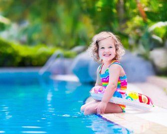 Cute Girl on the Pool—Pool Services in Manorville, NY