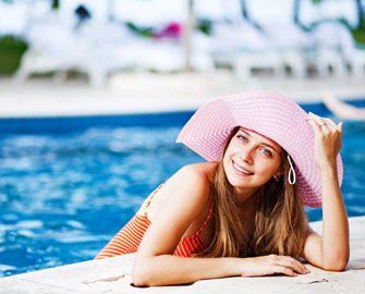 Woman on Pool—Pool Supplies in Manorville, NY Woman on Pool—Pool Supplies in Manorville, NY