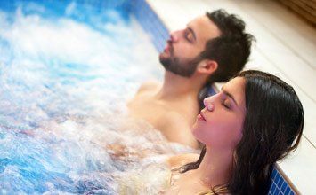 Couple relaxing in Pool—Pool Store in Manorville, NY