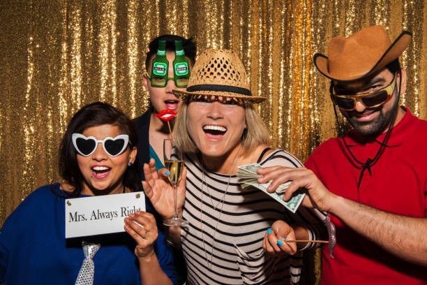Corporate photo booth with gold background.