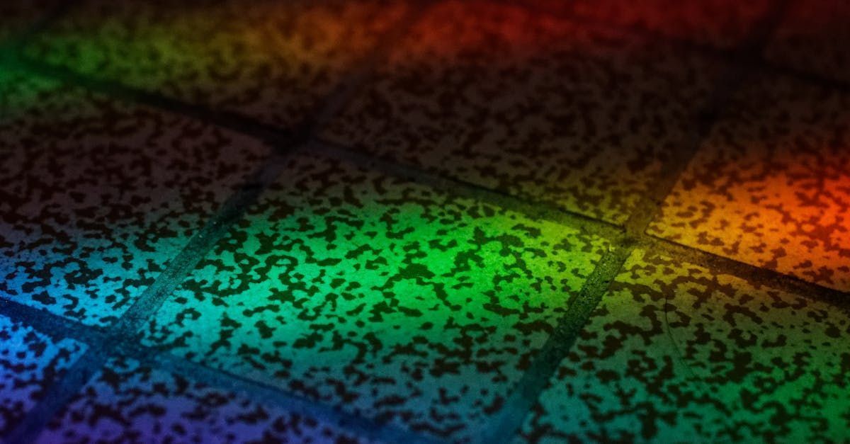 A rainbow of colors is shining on a brick wall.