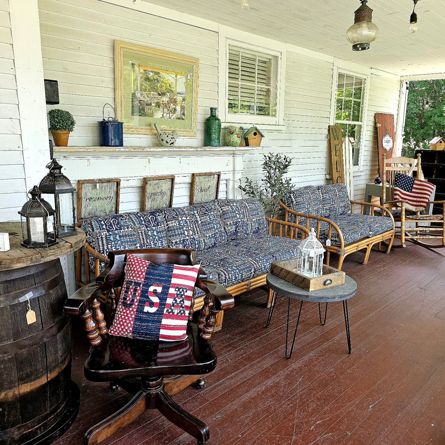 A chair with an american flag on it sits on a porch