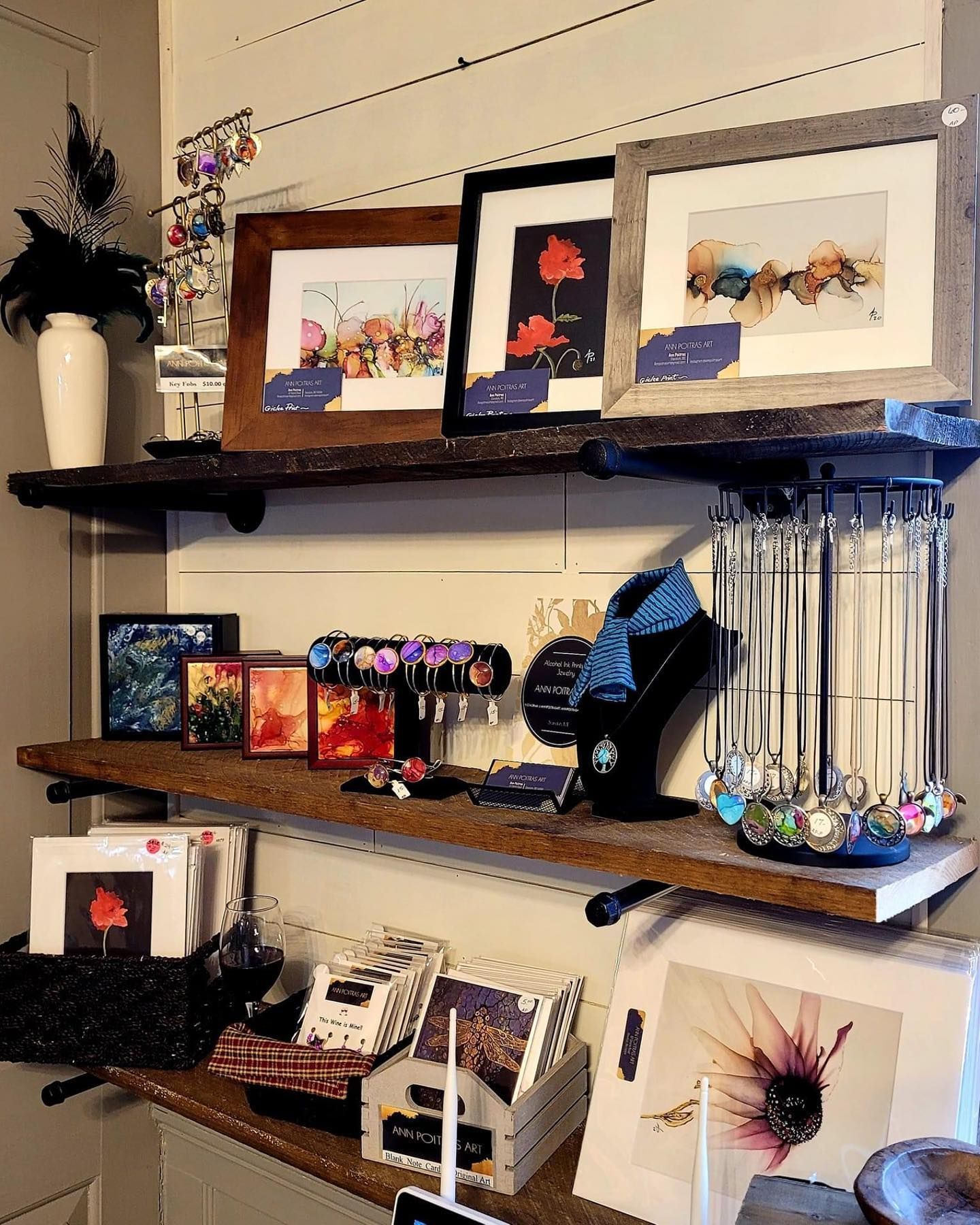 A shelf with a bunch of pictures on it