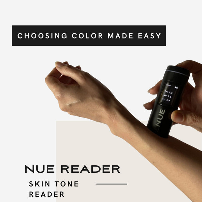 A person is holding a bottle of nue reader skin tone reader