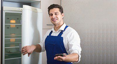 Checking Refrigerator — Refrigerator Service in Saugerties, NY
