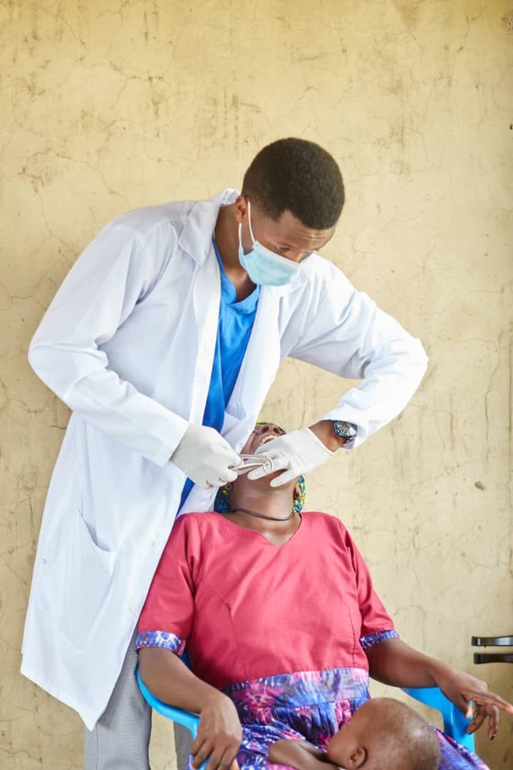Doctor examining a patient at Medical Camp in Ogul Village.