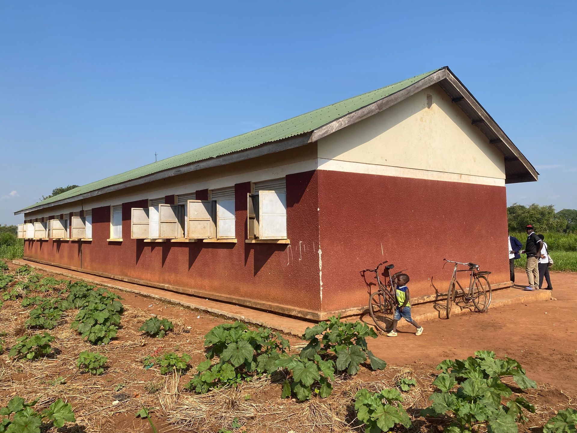 Nwoya, Uganda — the long classroom block on the 13-acre campus, June 2026.